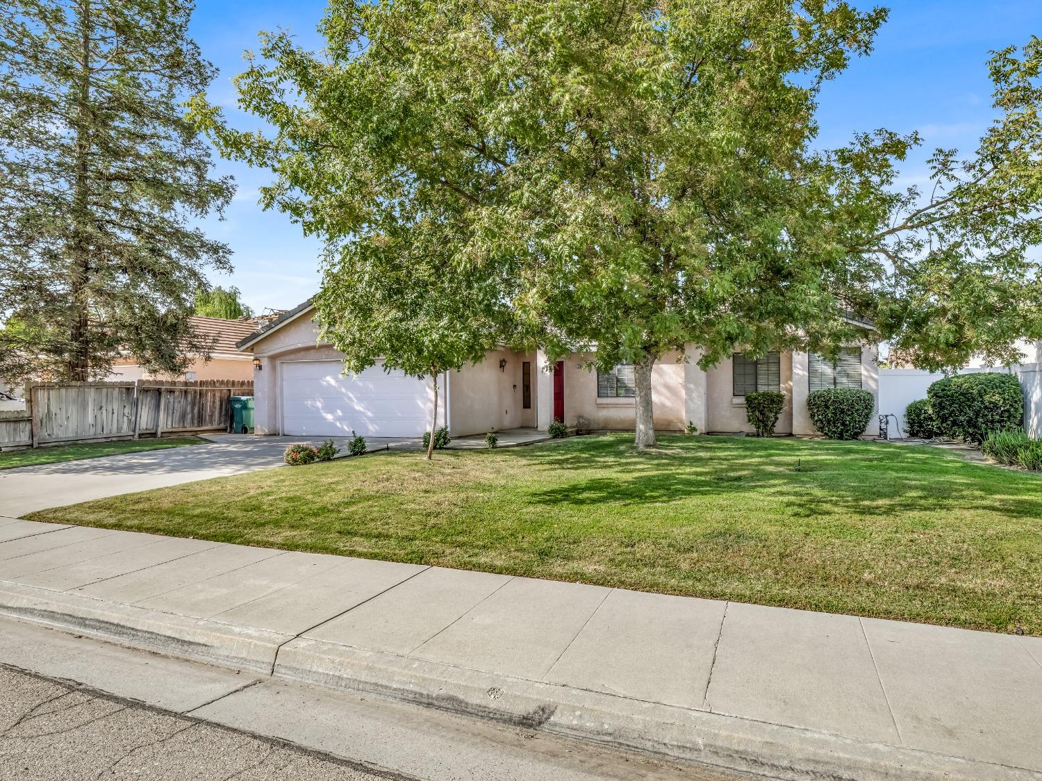 2048 Maple Street Selma, CA 93662 - Photo 1 of 20 a front view of a house with a yard and trees