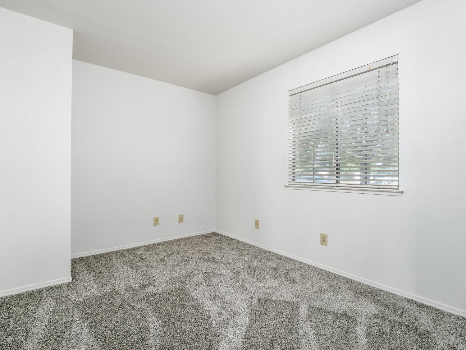 2048 Maple Street Selma, CA 93662 - Photo 13 of 20 an empty room with a window