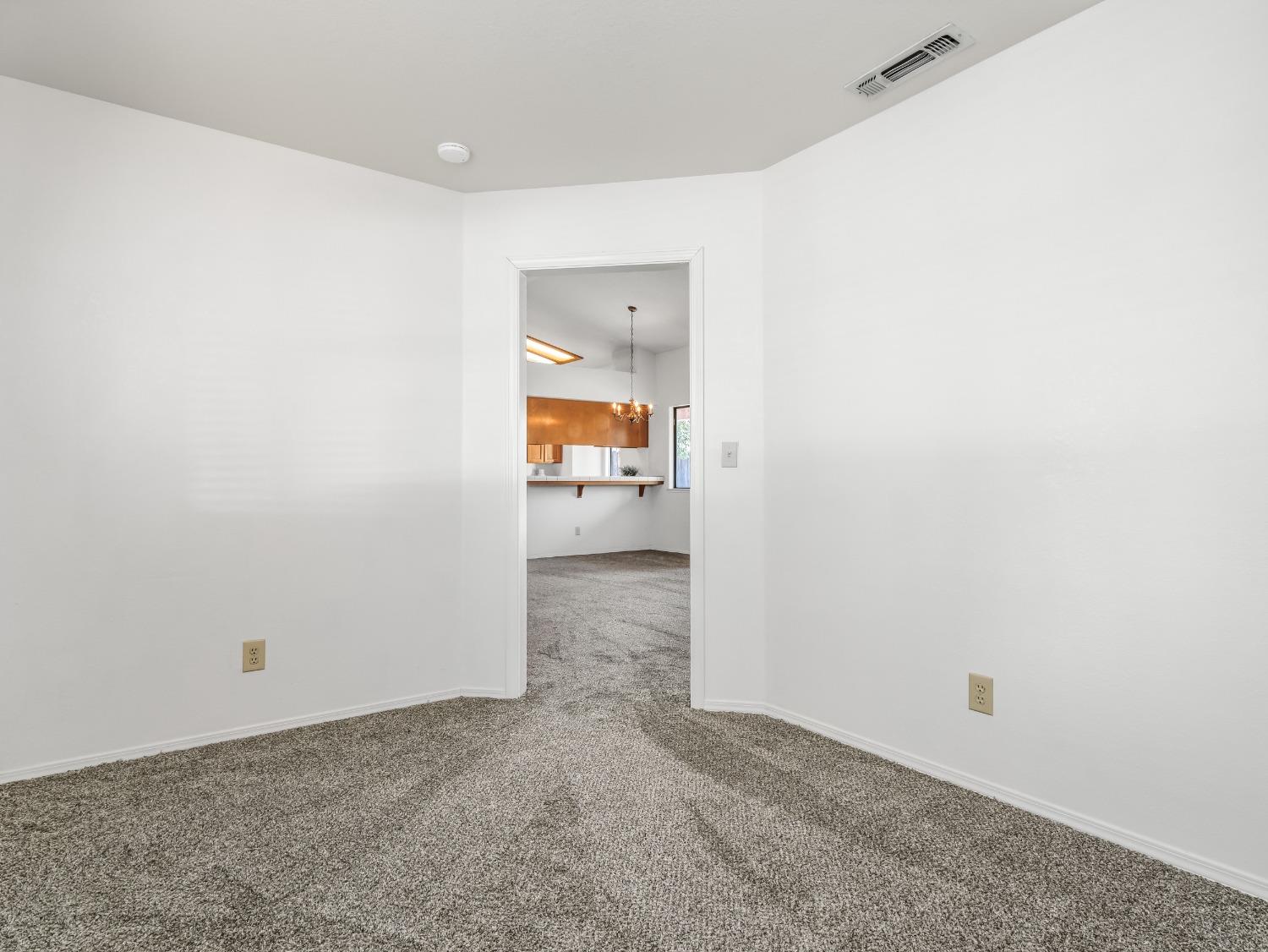2048 Maple Street Selma, CA 93662 - Photo 14 of 20 a view of a room with a hallway