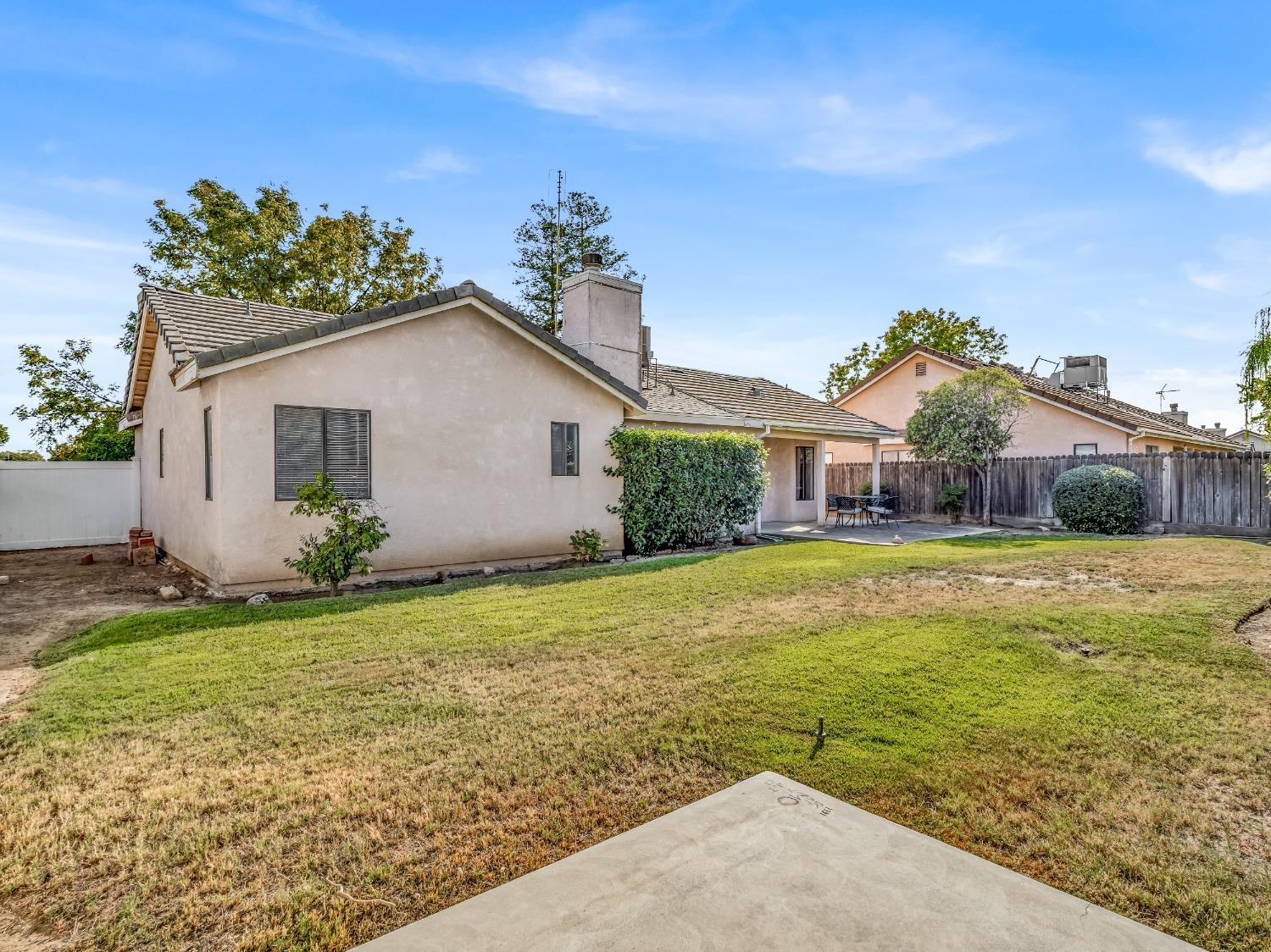 2048 Maple Street Selma, CA 93662 - Photo 18 of 20 a front view of house with yard and green space