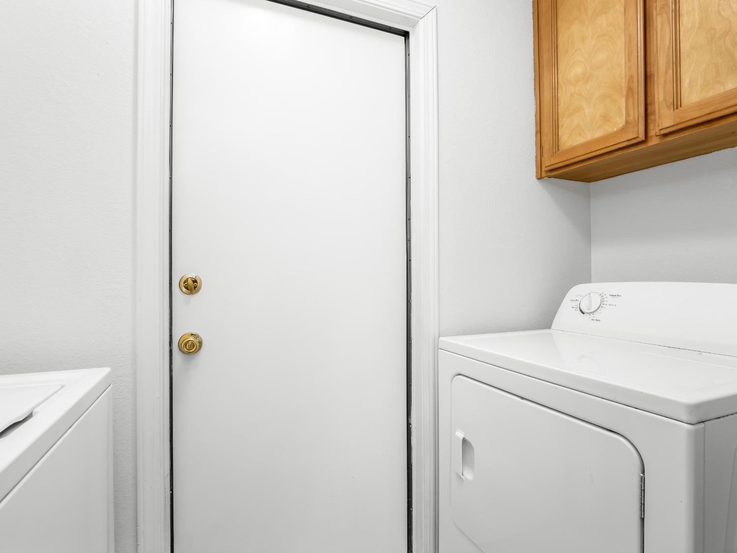 2048 Maple Street Selma, CA 93662 - Photo 19 of 20 a utility room with dryer and washer