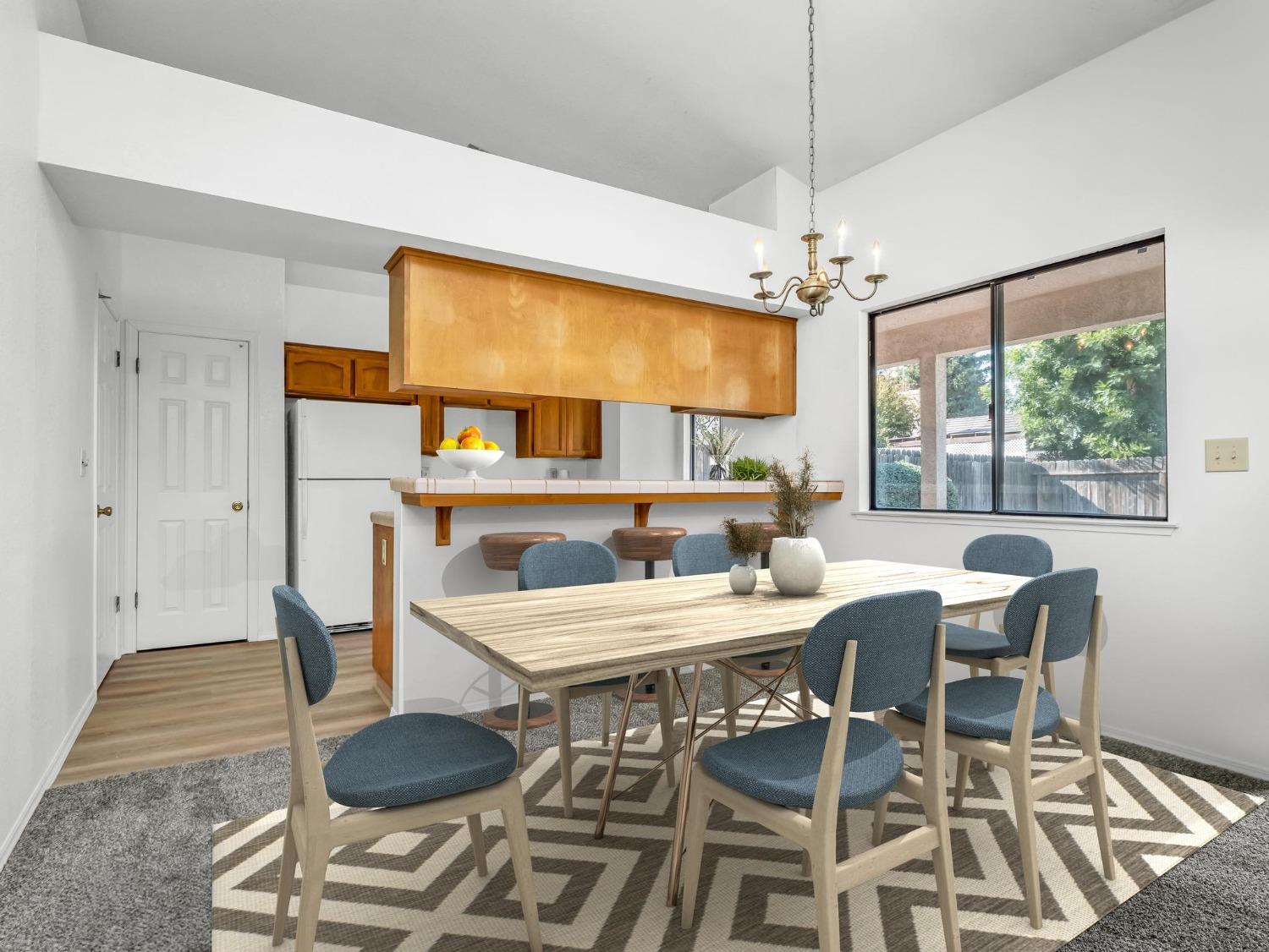 2048 Maple Street Selma, CA 93662 - Photo 4 of 20 a view of a dining room with furniture window and wooden floor