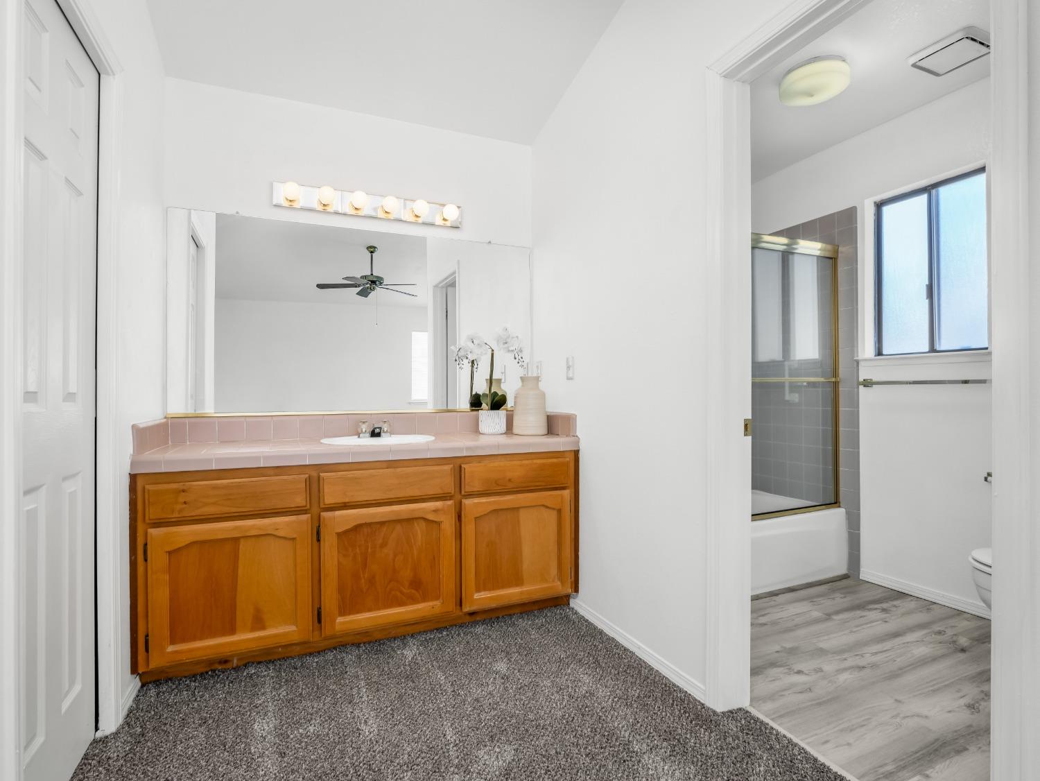 2048 Maple Street Selma, CA 93662 - Photo 9 of 20 a spacious bathroom with a double vanity sink and a mirror