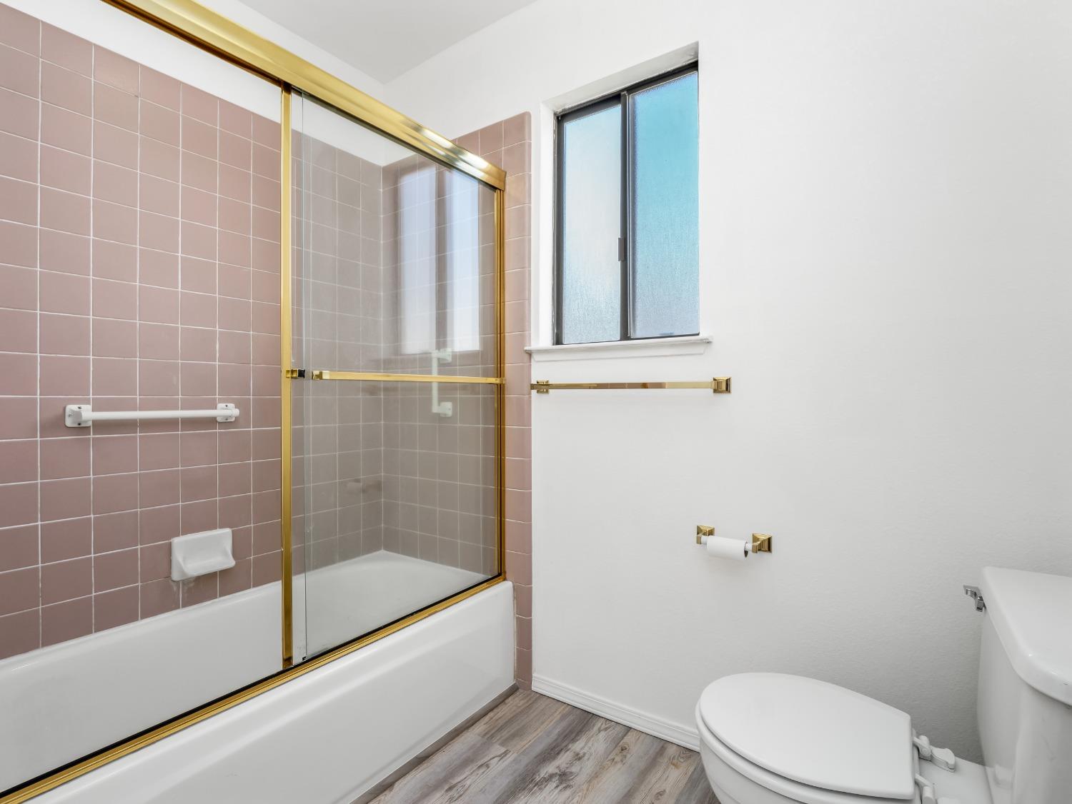 2048 Maple Street Selma, CA 93662 - Photo 10 of 20 a bathroom with a toilet and a shower