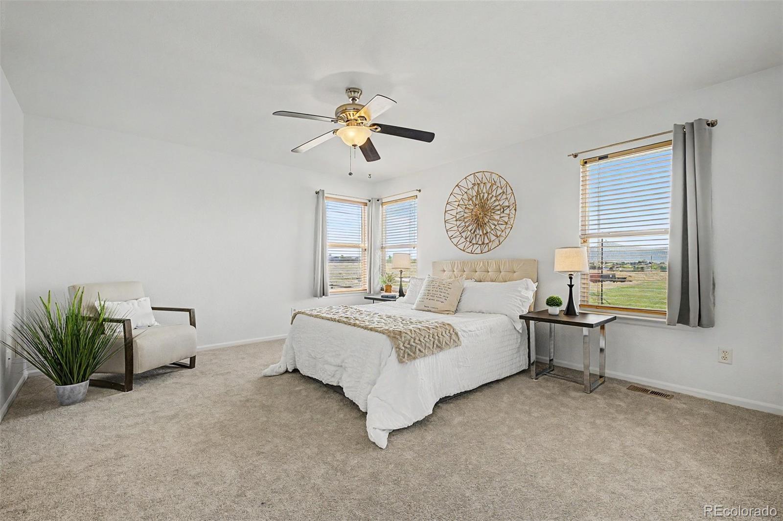 9917 Aftonwood Street Highlands Ranch, CO 80126 - Photo 20 of 48 a bed room with a bed and a chandelier