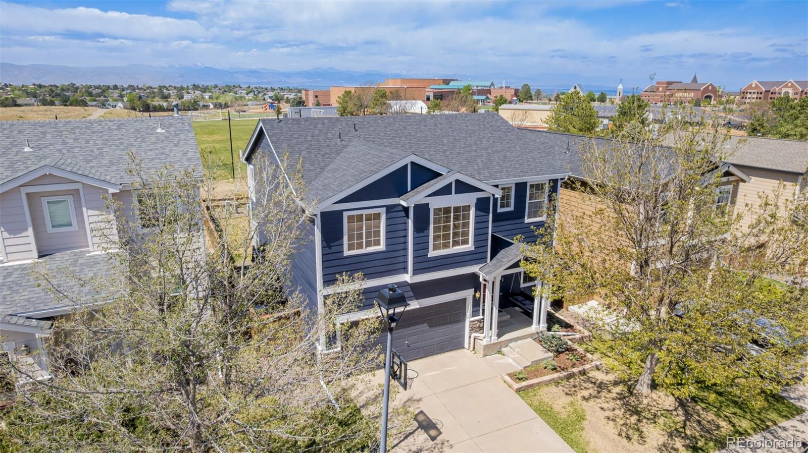 9917 Aftonwood Street Highlands Ranch, CO 80126 - Photo 2 of 48 a view of a house with a yard