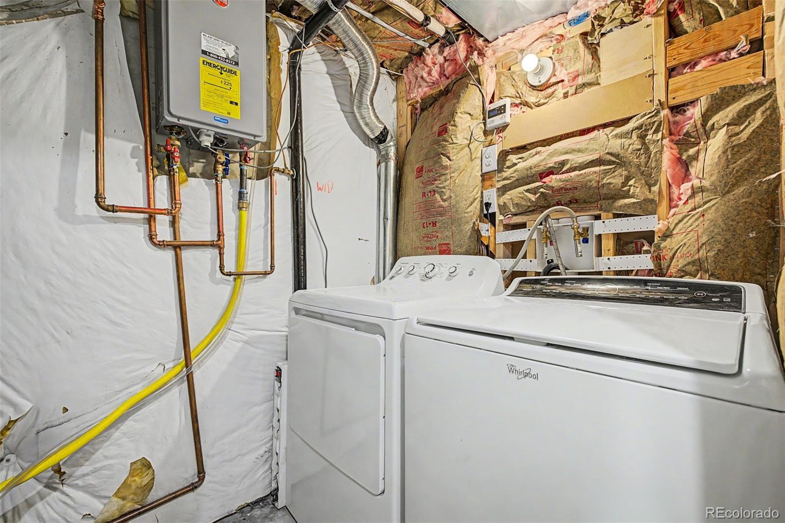 9917 Aftonwood Street Highlands Ranch, CO 80126 - Photo 38 of 48 a utility room with dryer and washer