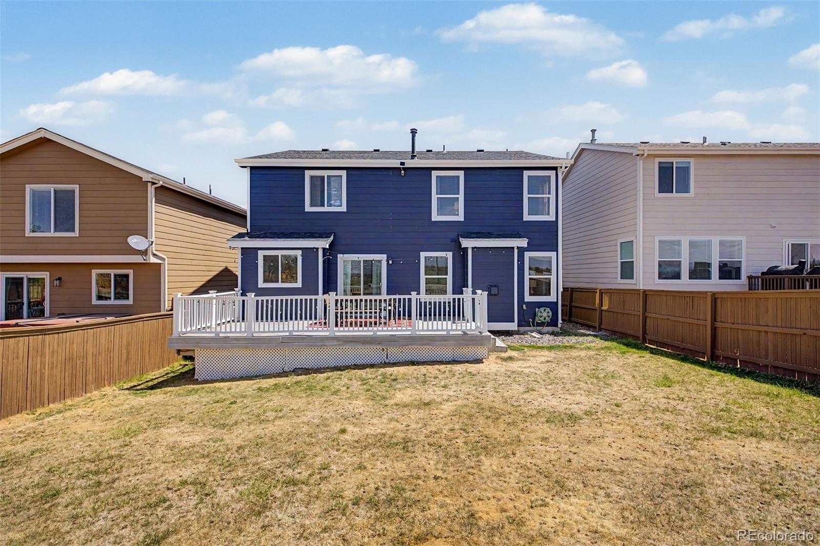 9917 Aftonwood Street Highlands Ranch, CO 80126 - Photo 43 of 48 a front view of a house with a yard