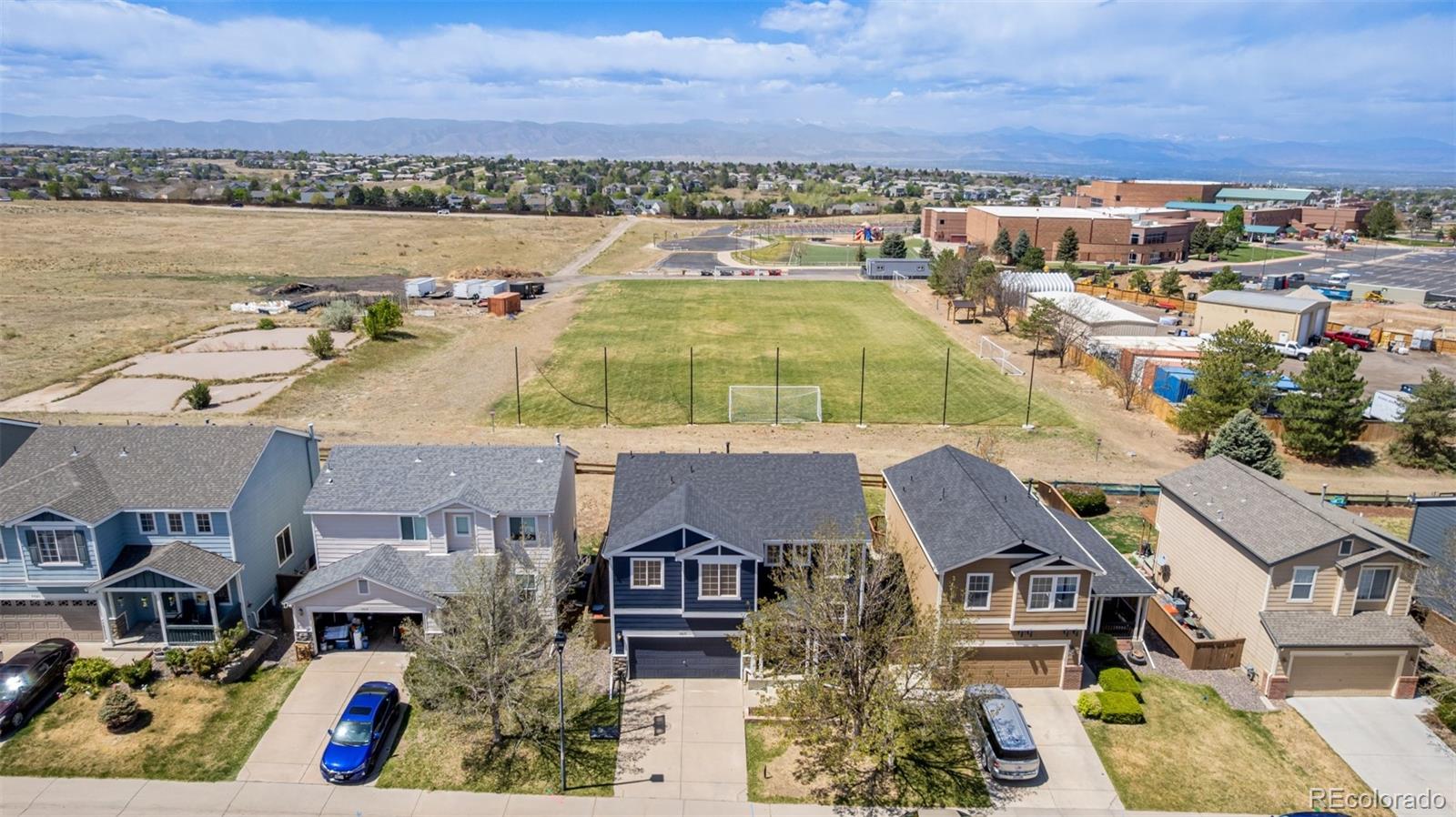 9917 Aftonwood Street Highlands Ranch, CO 80126 - Photo 44 of 48 an aerial view of residential houses with outdoor space