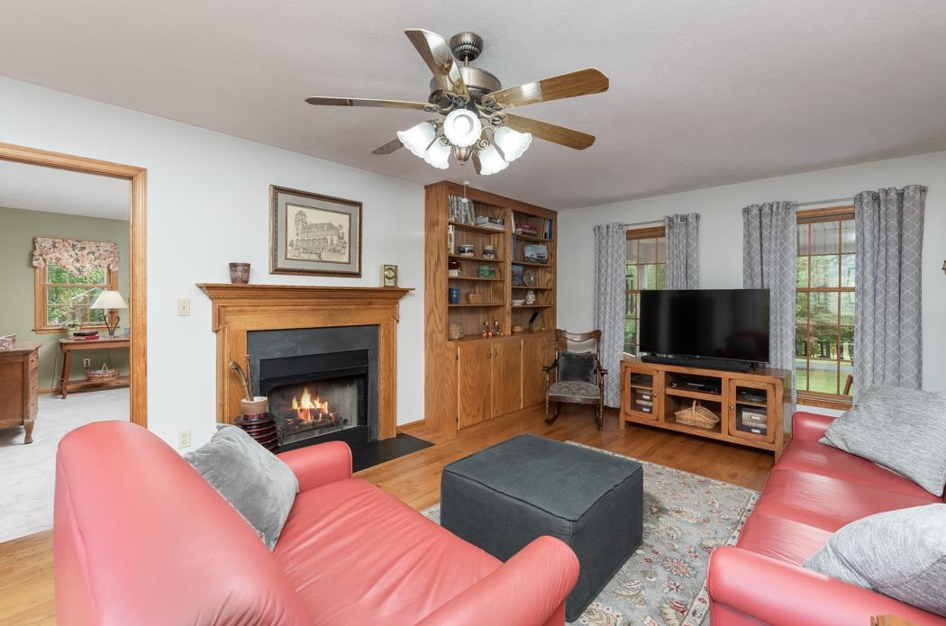 1284 Limestone Road Mount Sidney, VA 24467 - Photo 16 of 65 a living room with furniture a flat screen tv and a fireplace
