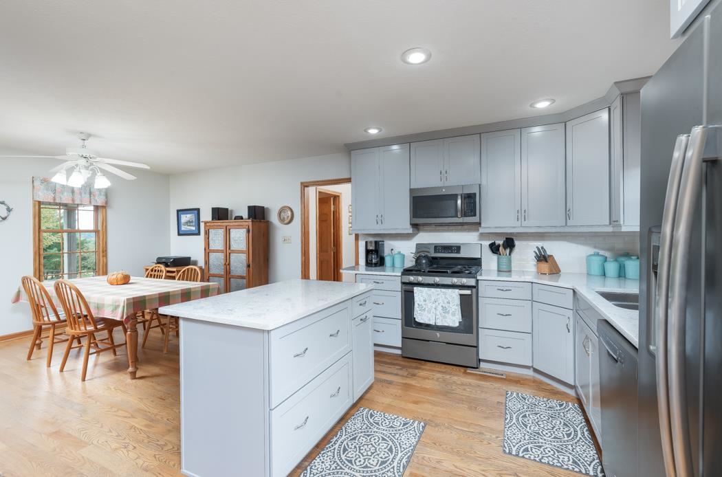 1284 Limestone Road Mount Sidney, VA 24467 - Photo 19 of 65 a kitchen with a stove a sink and a refrigerator