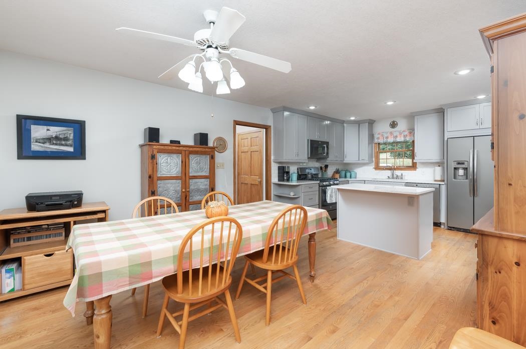 1284 Limestone Road Mount Sidney, VA 24467 - Photo 23 of 65 a kitchen with stainless steel appliances kitchen island granite countertop a dining table chairs refrigerator and sink