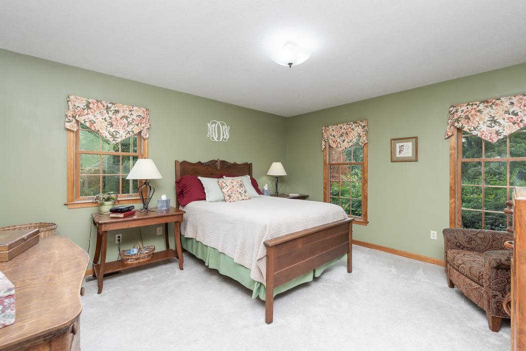 1284 Limestone Road Mount Sidney, VA 24467 - Photo 29 of 65 a bedroom with a bed and a couch