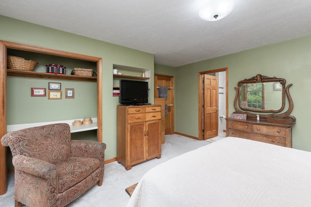 1284 Limestone Road Mount Sidney, VA 24467 - Photo 31 of 65 a bedroom with furniture and a flat screen tv