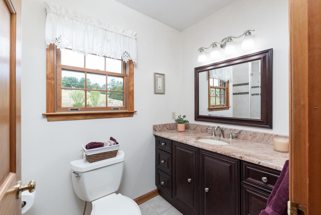 1284 Limestone Road Mount Sidney, VA 24467 - Photo 33 of 65 a bathroom with a toilet sink and mirror