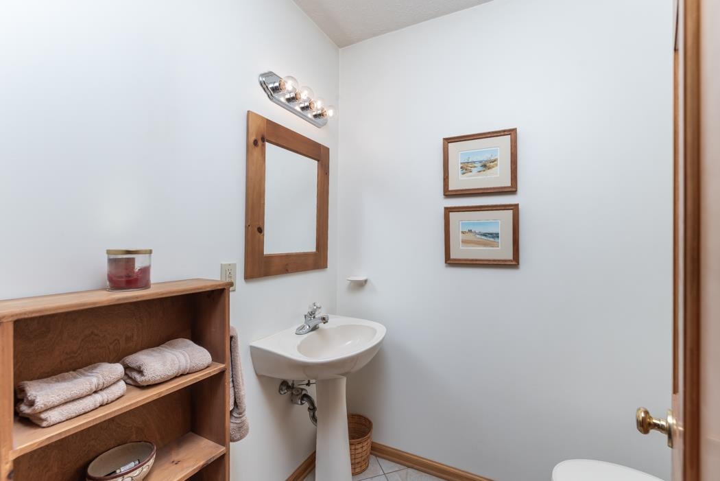 1284 Limestone Road Mount Sidney, VA 24467 - Photo 37 of 65 a bathroom with a toilet a sink and mirror