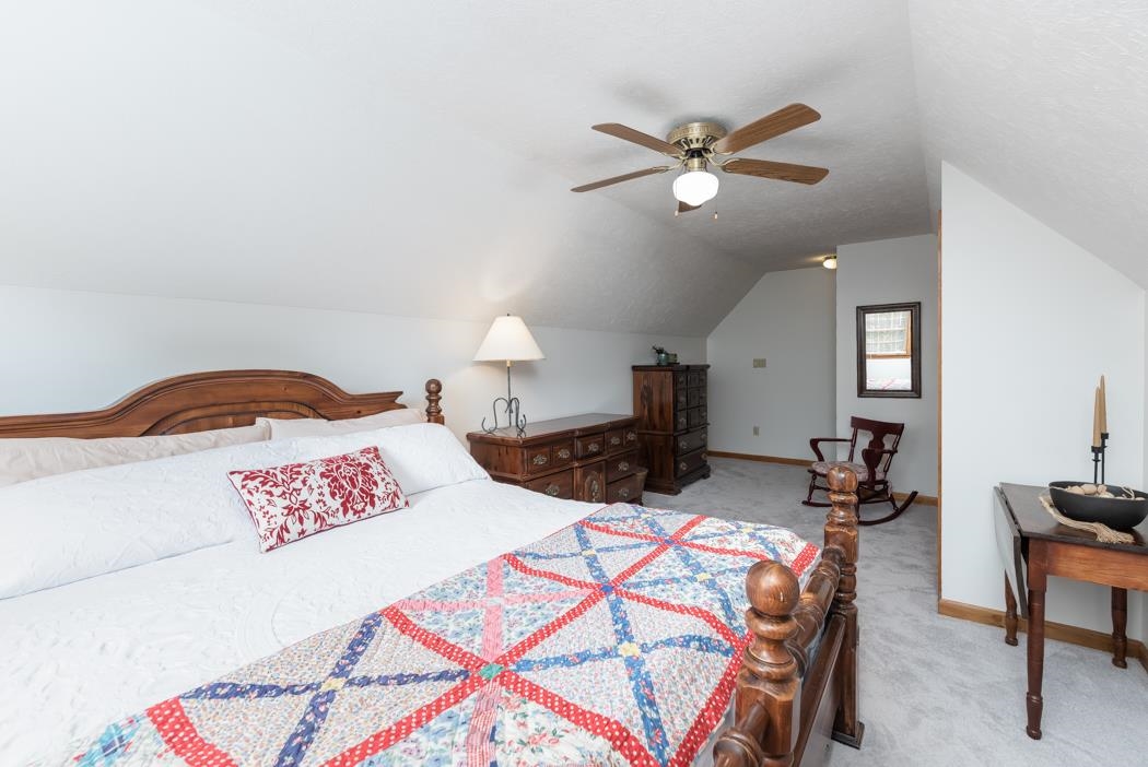 1284 Limestone Road Mount Sidney, VA 24467 - Photo 39 of 65 a bedroom with a bed and a chandelier