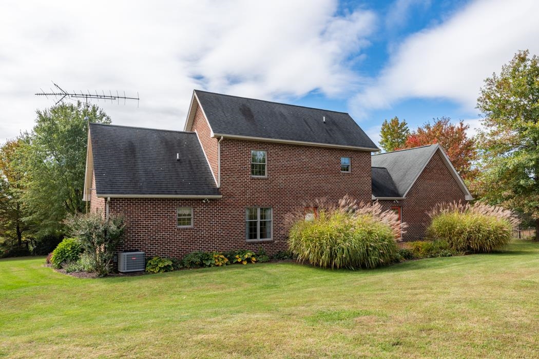 1284 Limestone Road Mount Sidney, VA 24467 - Photo 56 of 65 a front view of a house with a garden and yard