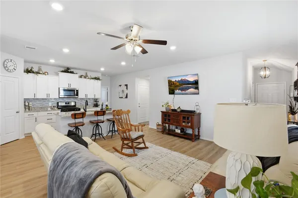 a view of a dining room with furniture and wooden floor