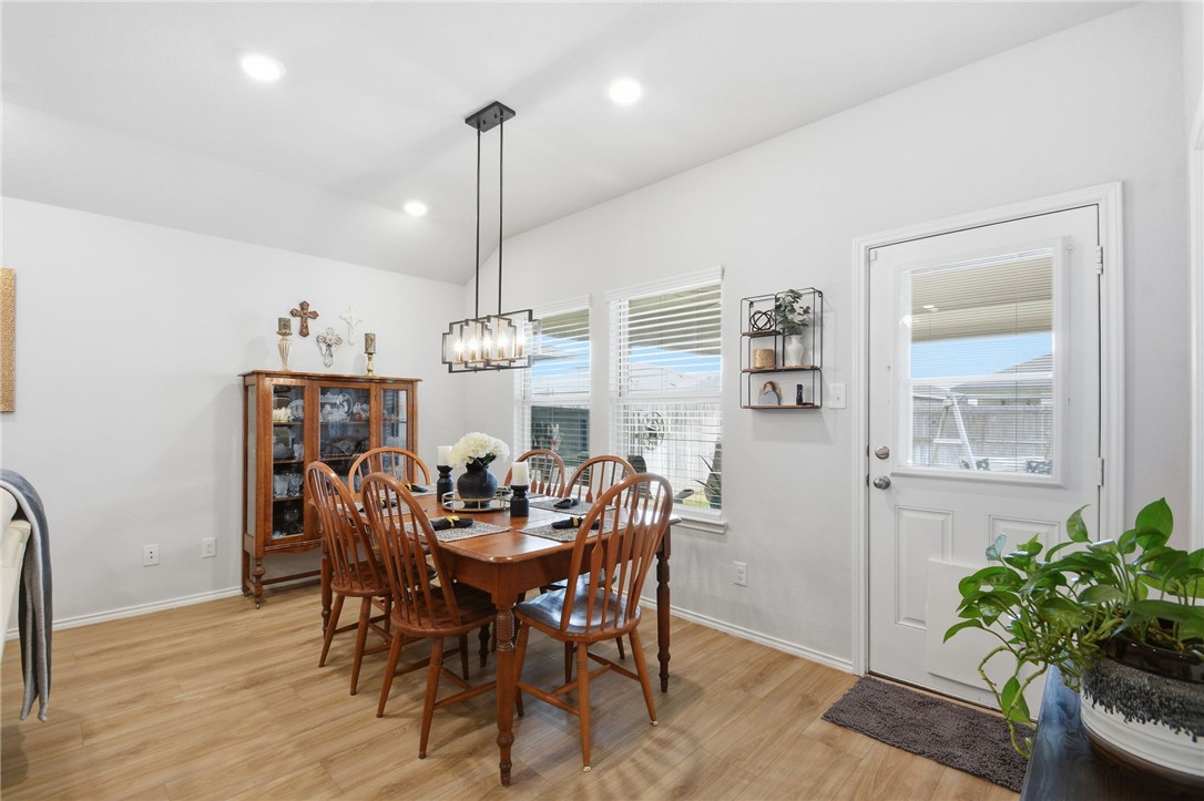 2425 Mulligan Lane Navasota, TX 77868 - Photo 13 of 48 a view of a dining room with furniture and wooden floor