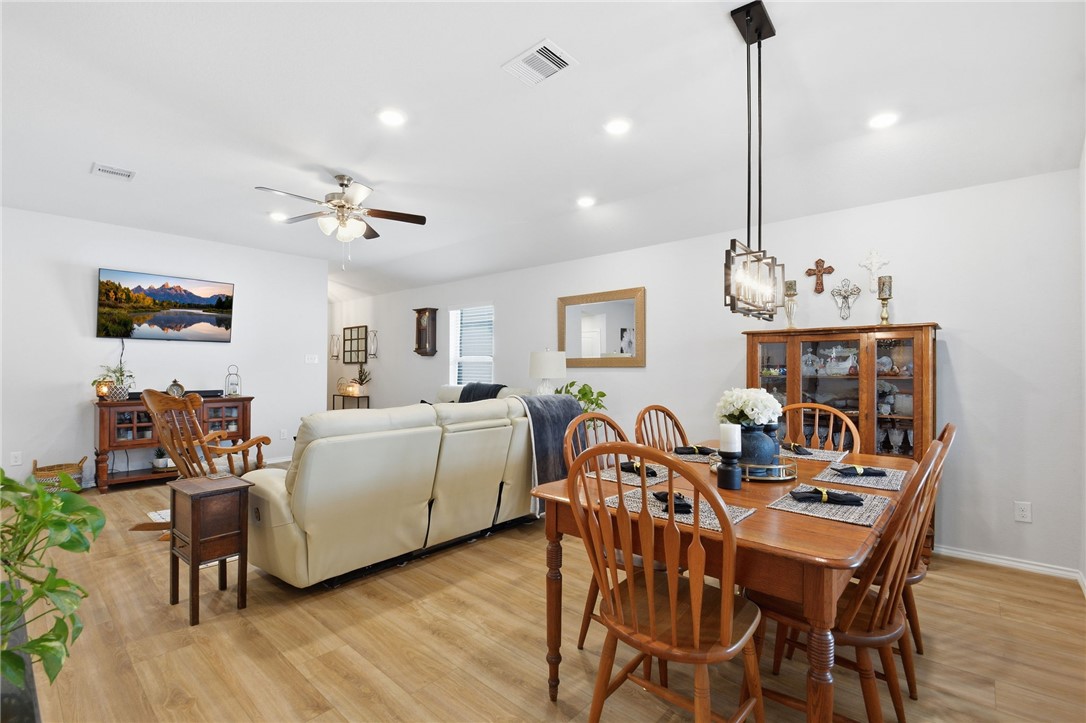 2425 Mulligan Lane Navasota, TX 77868 - Photo 16 of 48 a view of a dining room with furniture and wooden floor