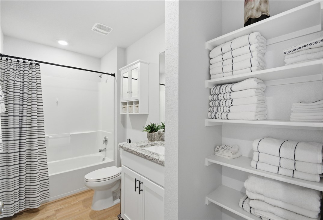 2425 Mulligan Lane Navasota, TX 77868 - Photo 25 of 48 a bathroom with a sink a toilet and shower