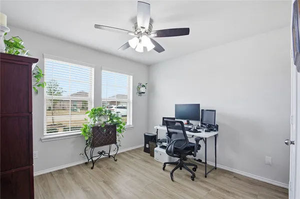 a en suite bathroom with a double vanity sink and a mirror