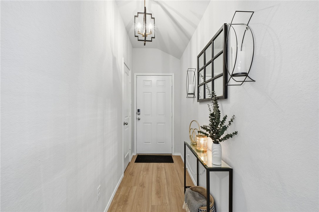 2425 Mulligan Lane Navasota, TX 77868 - Photo 7 of 48 a view of a hallway with wooden floor and staircase