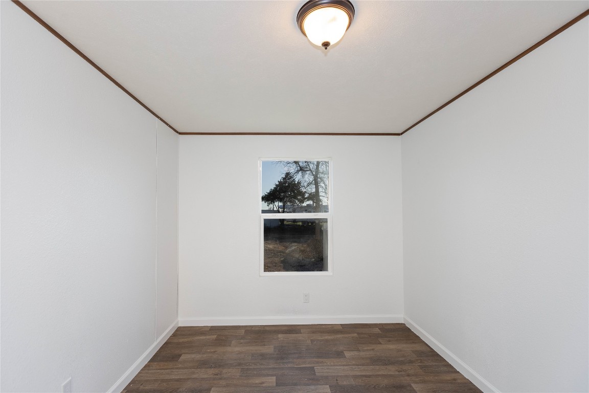 145 Crooked Road Dale, TX 78616 - Photo 12 of 26 a view of a room with wooden floor and windows