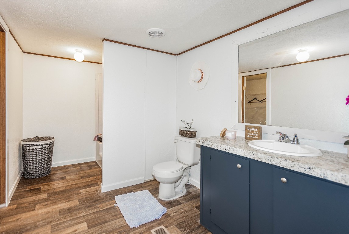 145 Crooked Road Dale, TX 78616 - Photo 16 of 26 a bathroom with a granite countertop sink toilet and shower