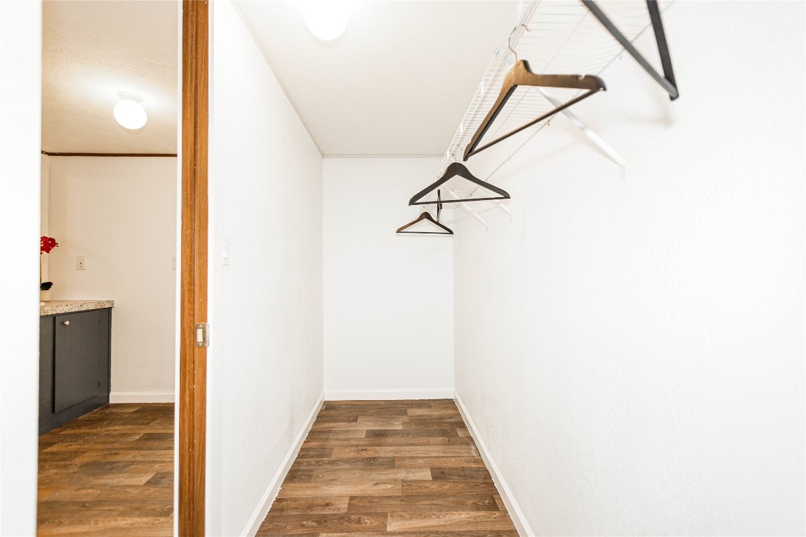 145 Crooked Road Dale, TX 78616 - Photo 19 of 26 a view of a hallway with wooden floor