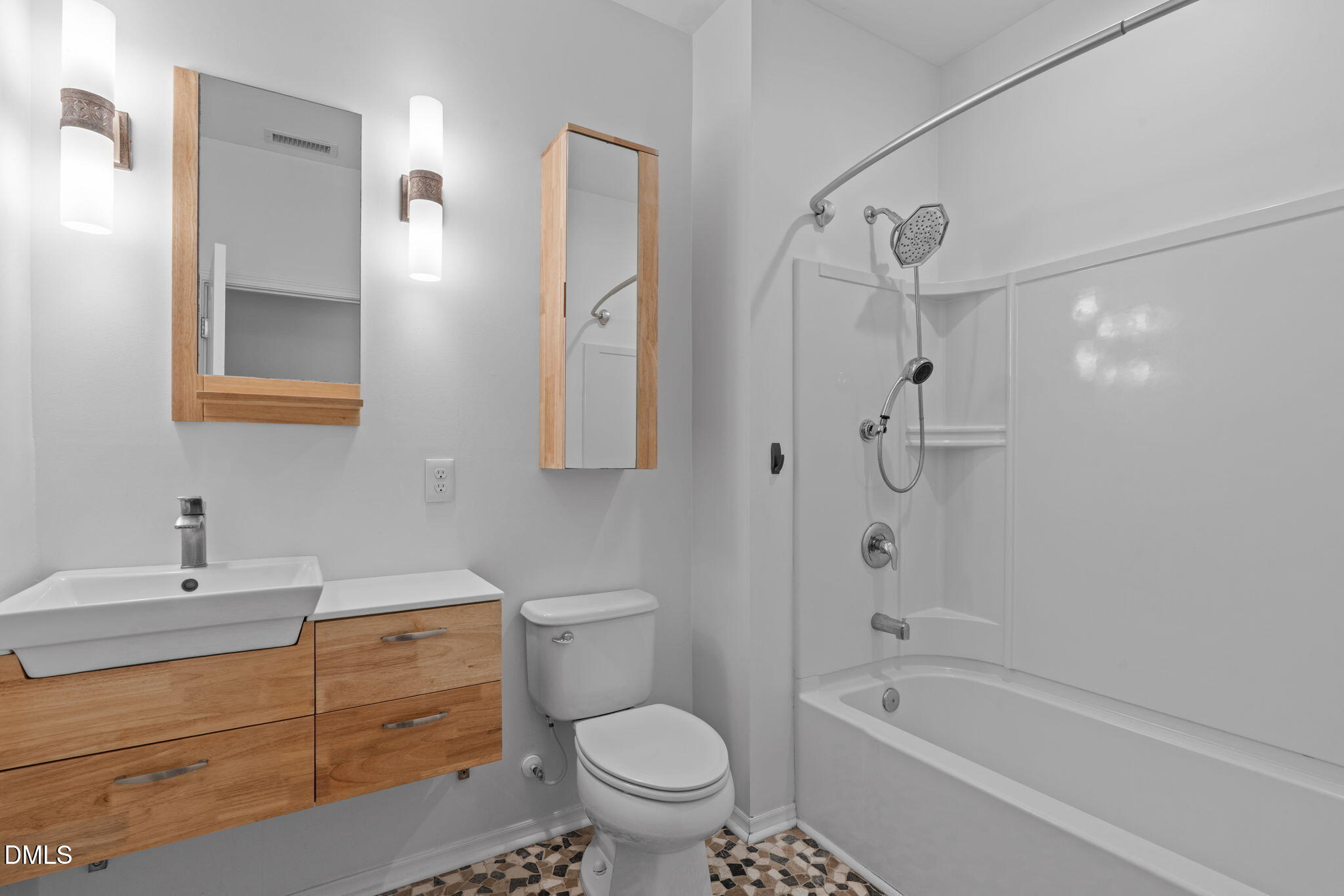 124 Daneborg Road Durham, NC 27703 - Photo 7 of 40 a bathroom with a sink a toilet and a bathtub