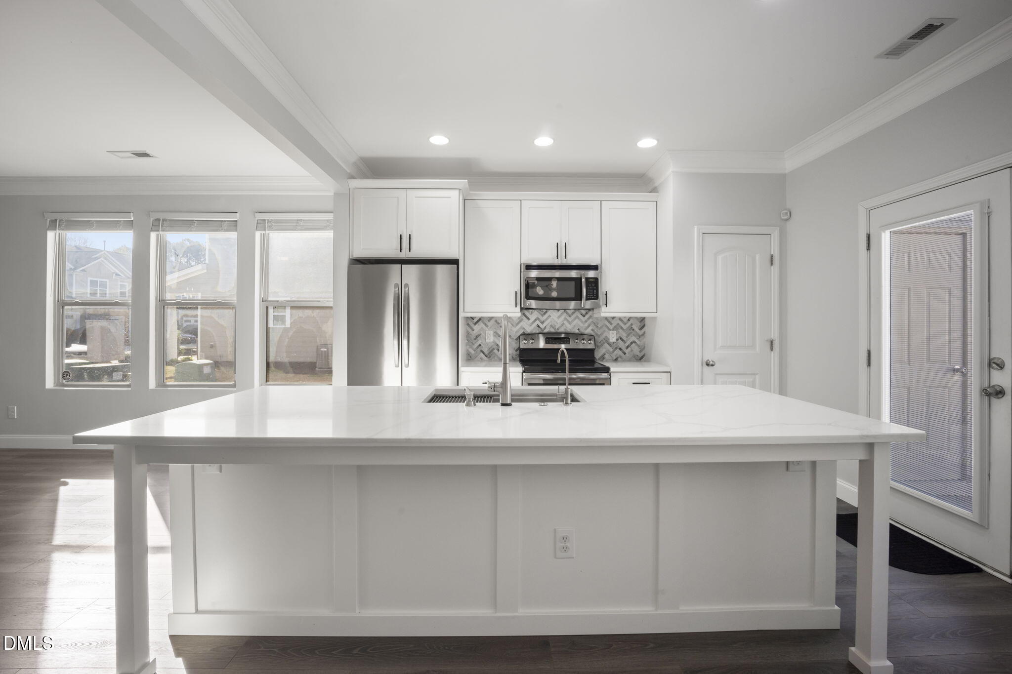 201 Leighann Ridge Lane Rolesville, NC 27571 - Photo 2 of 48 Completely Renovated Kitchen with Quartz Counters, Oversized Island, Touchless Sink, All new Stainless Steel Appliances, Dove-tailed Custom Cabinets with soft close cabinet doors & Drawers, Custom trim Work.