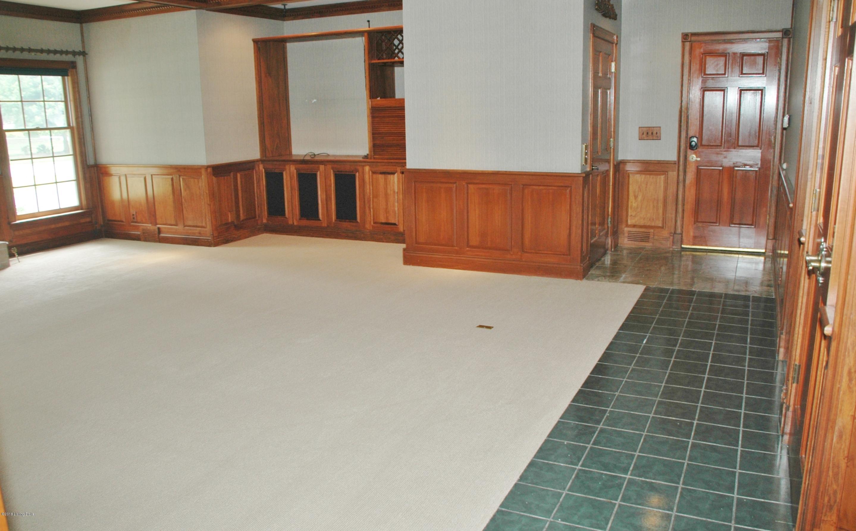 813 Rugby Place Louisville, KY 40222 - Photo 11 of 54 1st floor family room. Elevator at end of hall on left.