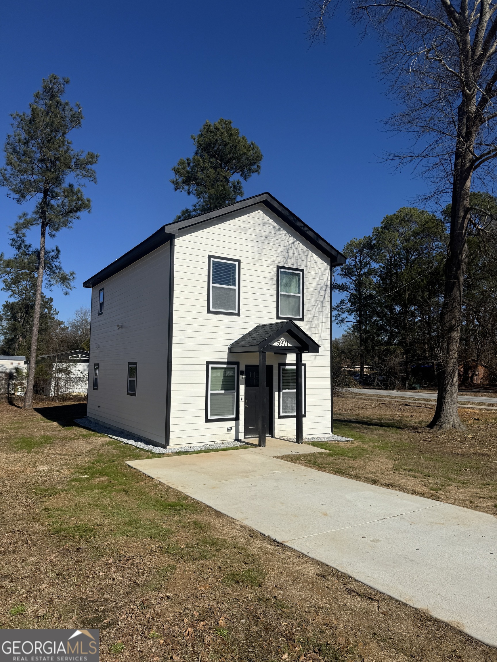 5971 Bloomfield Road Macon, GA 31206 - Photo 2 of 19 a front view of a house with a yard