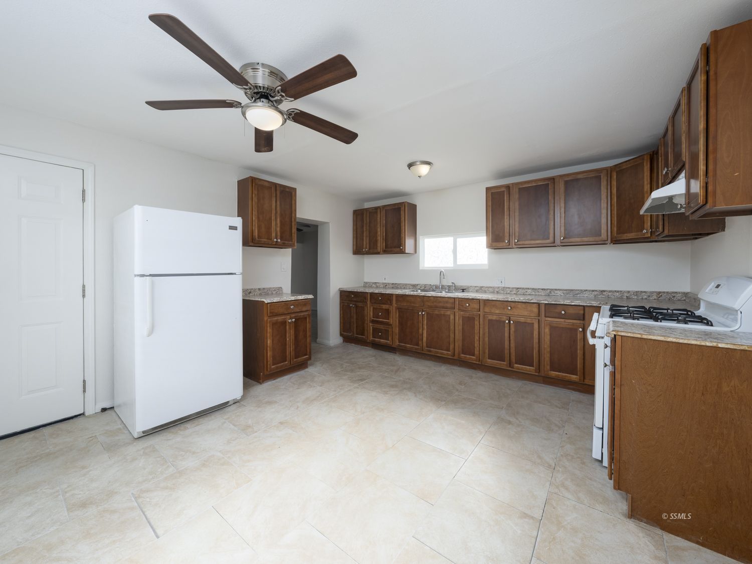419 West Haloid Avenue Ridgecrest, CA 93555 - Photo 4 of 29 a kitchen with stainless steel appliances granite countertop a refrigerator a stove a sink dishwasher and a stove
