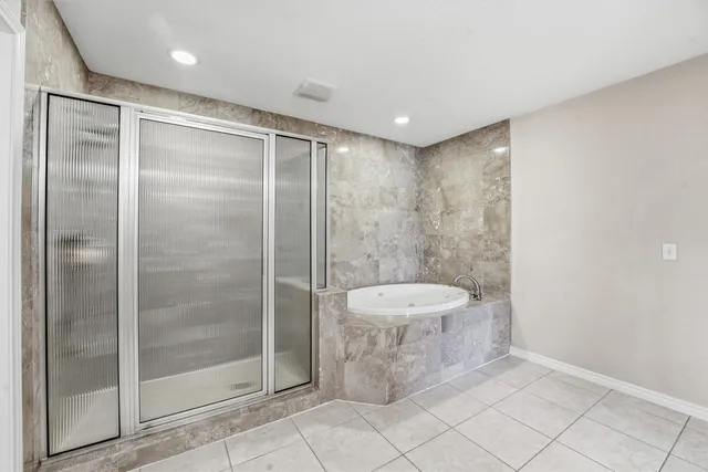 a bathroom with a shower and a sink
