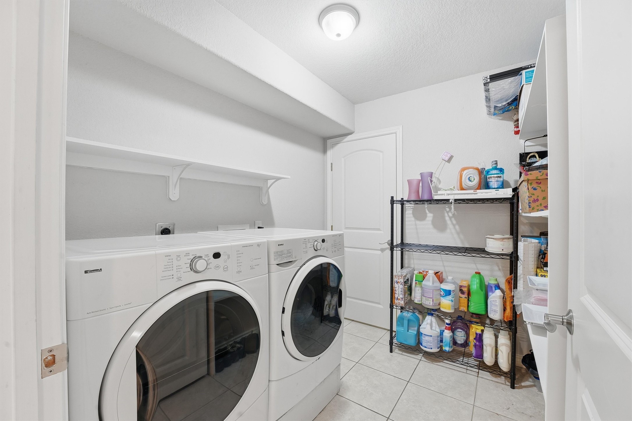 3227 Audley Street Houston, TX 77098 - Photo 25 of 30 a view of storage and utility room with washer and dryer