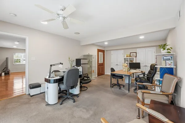 a view of a livingroom with furniture and a workspace