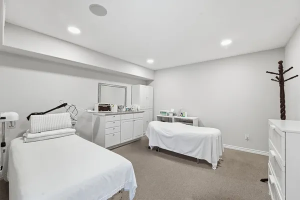 a room with a bed and a chair