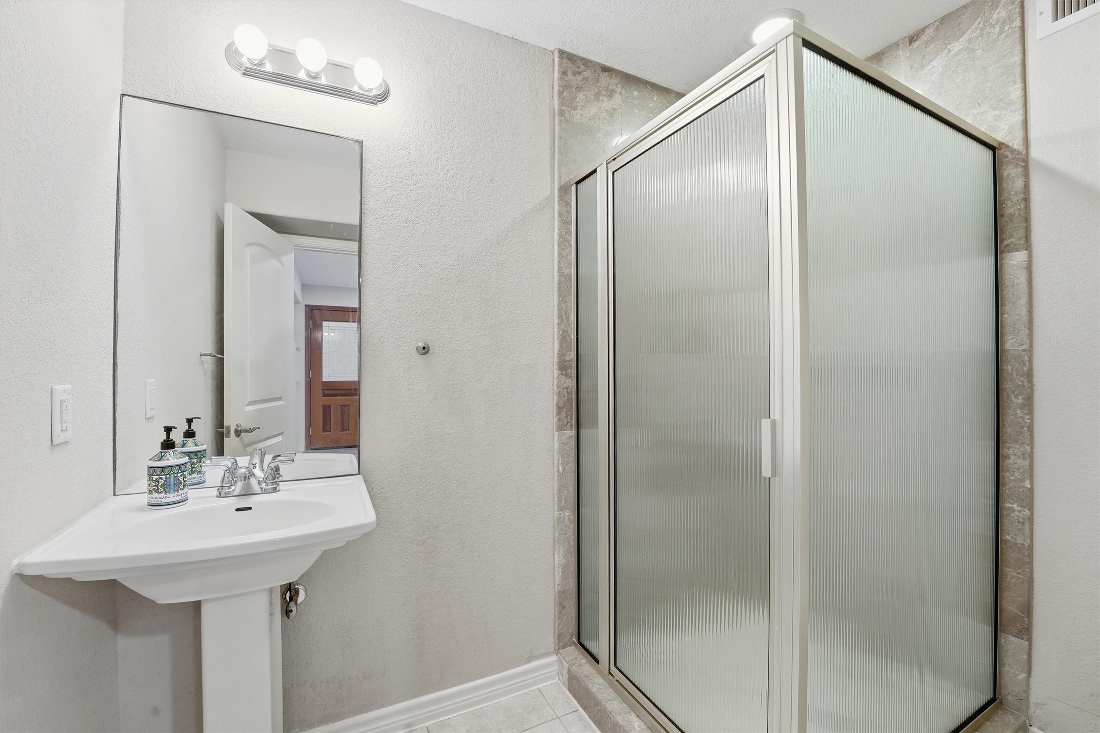 3227 Audley Street Houston, TX 77098 - Photo 30 of 30 a bathroom with a sink and mirror