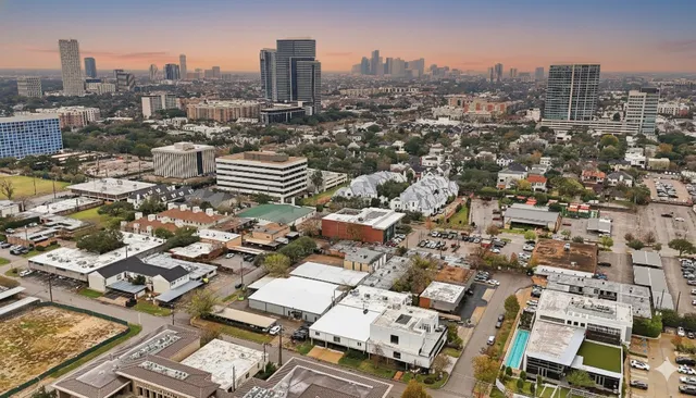 an aerial view of a city with lots of residential buildings