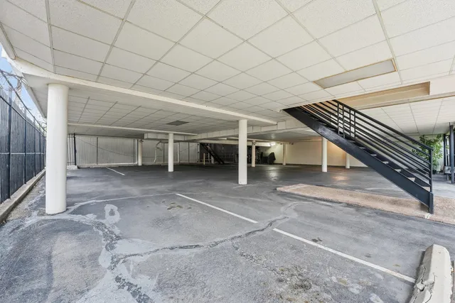 a view of an empty room with stairs