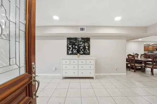 a view of a bedroom with furniture and windows