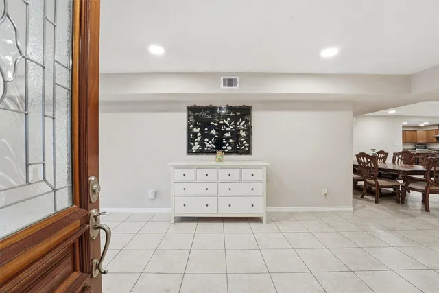 a view of a bedroom with furniture and windows