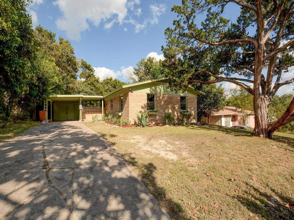 406 Post Rd Drive Austin, TX 78704 - Photo 1 of 1 a backyard of a house with fire pit and trees