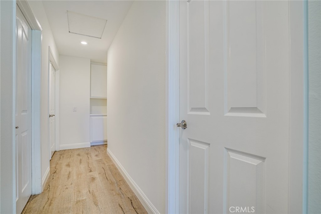 49 East Yale Loop, Unit 26 Irvine, CA 92604 - Photo 20 of 63 a view of a hallway with wooden floor
