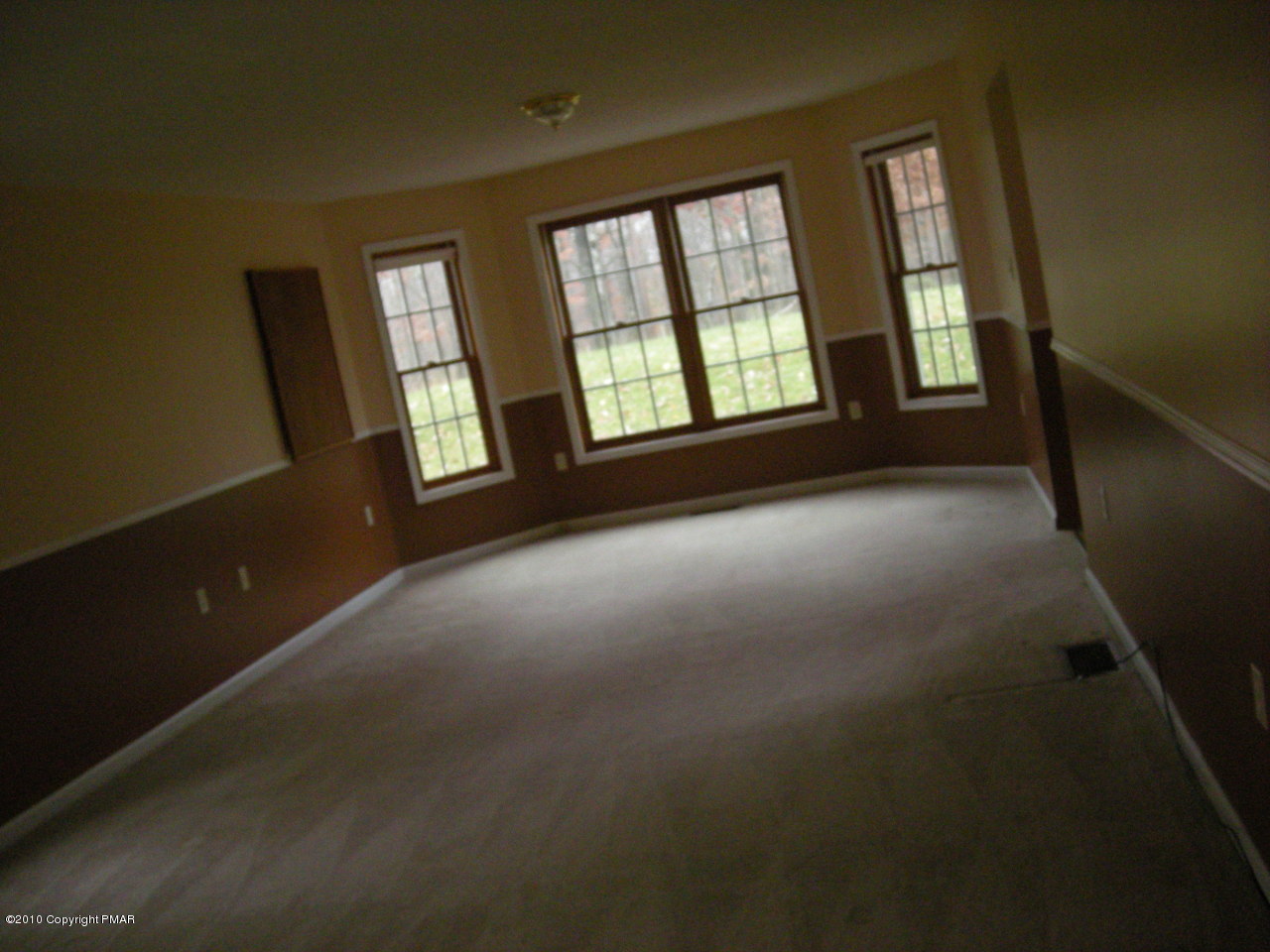 719 Dancing Ridge Road East Stroudsburg, PA 18302 - Photo 4 of 12 a view of an empty room with windows and closet