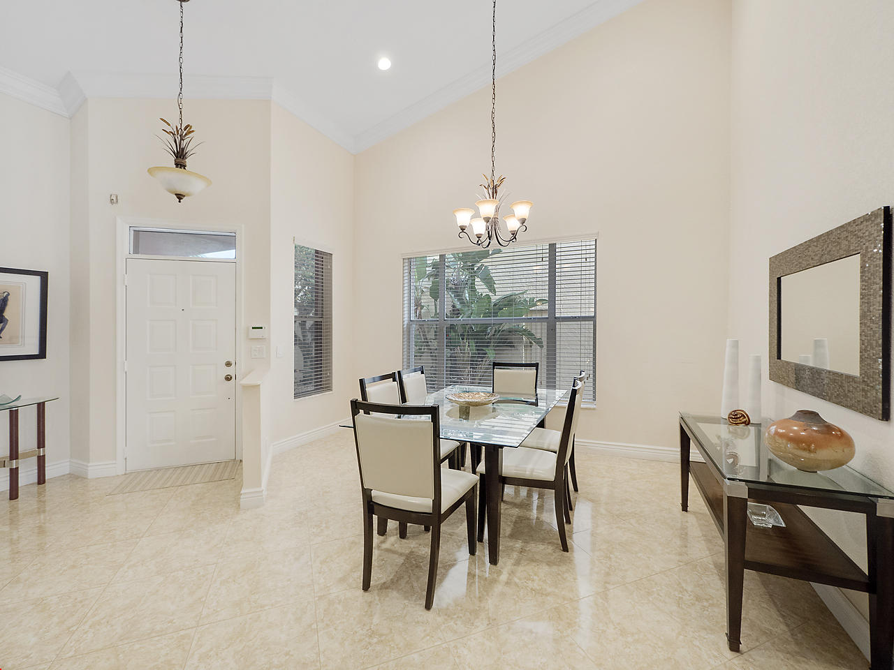 8354 Horseshoe Bay Road Boynton Beach, FL 33472 - Photo 2 of 13 a dining room with furniture a chandelier and wooden floor