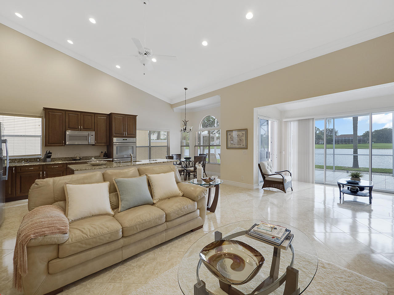 8354 Horseshoe Bay Road Boynton Beach, FL 33472 - Photo 4 of 13 a living room with furniture and a flat screen tv with wooden floor